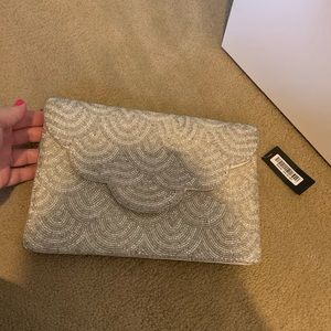 Lulus clutch with tags